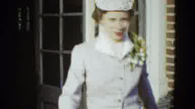 Boston Mass (1951): A Woman Wearing A Dress And Hat And White Gloves Walks Out Of