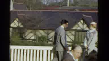 Boston Mass (1951): Man Wearing Grey Suit Walks To Woman Wearing White Hat