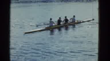 Boston Mass-1951: Four Men Rowing Scull Boat On Lake On A Clear Day