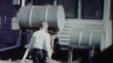 Cheyenne County Kansas (1958): Boy Approached Barrels By House But Abruptly Halts