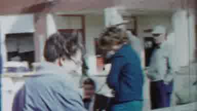 Cheyenne County Kansas (1958): Woman Wearing Blue Coat Walks Behind Red Truck On A