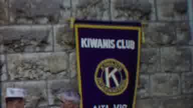 Cheyenne County Kansas (1958): Club Banner Hanging On Cobblestone On A Windy Day
