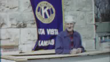 Cheyenne County Kansas (1958): Old Man In Front Of A Blue Flag That States Alta