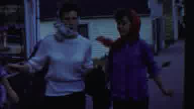 Cheyenne County Kansas (1958): Three Young Women Wearing Headscarves Run On A