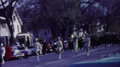 Cheyenne County Kansas (1958): People Walk In Parade On City Street Past Buildings