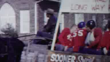 Cheyenne County Kansas (1958): Men In Football Uniforms Sit In A Carriage Being