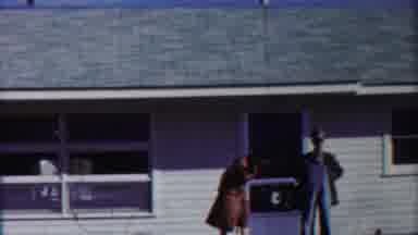 Cheyenne County Kansas (1958): Male And Female Waiting On The Porch When Female
