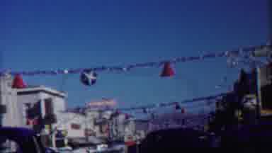 Cheyenne County Kansas (1958): Driving Car In City Street With Hanging Decorations