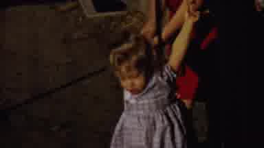 Saint Francis Kansas (1958): Mother Helps Her Baby Daughter Wear A Sweater
