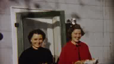 Saint Francis Kansas (1958): Woman Wearing Red Sweater Holds Meat Platter While