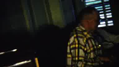 Saint Francis Kansas (1958): Man Wearing White Plaid Shirt And Glasses Talks To