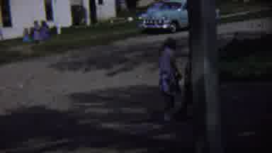 Chadron Nebraska (1959): Two Little Girls Walk Across Park While Adults Watch In