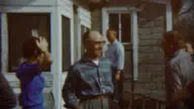 Chadron Nebraska (1959): A Group Of Family Members Are Talking And Around The