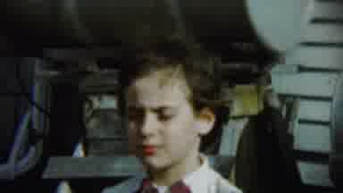 Chadron Nebraska (1959): Girl Wearing White Shirt Stand In Front Of Grey Tanks On