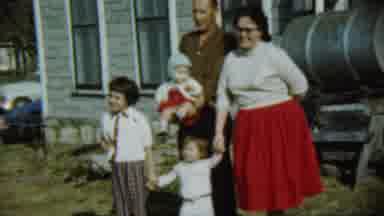 Chadron Nebraska (1959): Family Of Five Poses Beside Silver Tank On A Clear Day