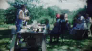 Chadron Nebraska (1959): Woman And Others At Outside Picnic Standing And Sitting