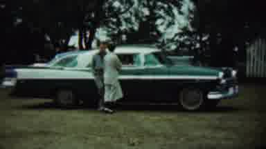Chadron Nebraska (1959): Sweet Couple Talks To Someone Inside A Car