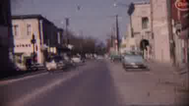Cheyenne County Kansas (1959): A Road With Full Of Cars And Vehicles Moving Around