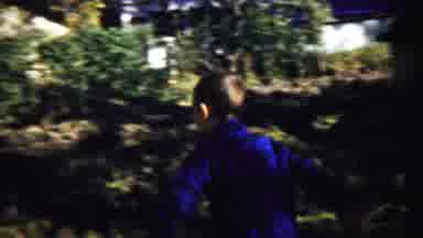Cheyenne County Kansas (1959): Boy Wearing Blue Shirt Runs To Green Tree On A