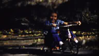 Cheyenne County Kansas (1959): Mom Helps His Son Play His New Bicycle