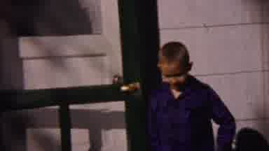 Cheyenne County Kansas (1959): Boy In A Blue Plaid Shirt Closes Door And Walks Out