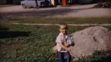Cheyenne County Kansas (1959): Little Boy Hurriedly Stands To Pose In Front Of A