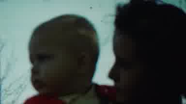 Saint Francis Kansas (1959): A Woman Is Holding-Hands A Little Baby With A Red