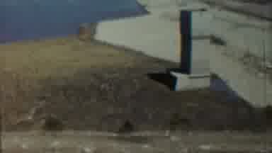 Saint Francis Kansas (1959): Slow Panning Of Stone Water With Pavement And Dirt