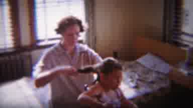 South Bend Indiana (1958): A Woman Is Combing The Hair Child While Another Child