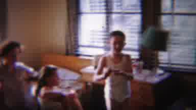 South Bend Indiana (1958): Boy Wearing White Shirt Gives Object To Girl Getting