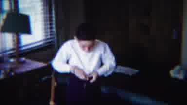 South Bend Indiana (1958): Boy Wearing White Shirt Fastens Belt Over Pair Of Black