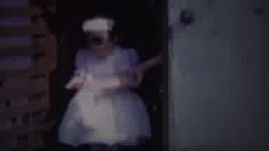 South Bend Indiana (1958): Flower Girl Prepares To Go Outside The House To Attend