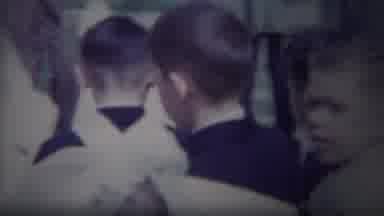 South Bend Indiana (1958): Two Children In Lead Followed By A Crowd Walking