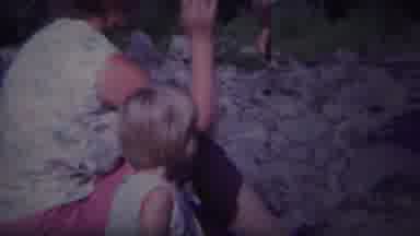 Yellowstone Wyoming (1967): Woman Wearing Pink Shorts Throws Pebbles With Girl