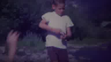 Yellowstone Wyoming (1967): Two Children Laugh And Skip Rocks By The Edge Of A