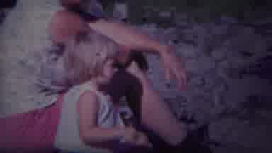 Yellowstone Wyoming (1967): A Little Baby Is Sitting Near A Woman And Is Taking A