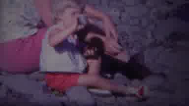 Yellowstone Wyoming (1967): Little Kid Sitting On A Beach With Her Parents Digging