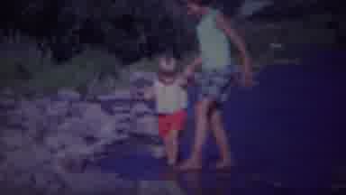 Yellowstone Wyoming (1967): Two Young Girls Walking On Rocks Near A Lake Happy And