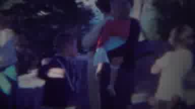 Yellowstone Wyoming (1967): Woman Wearing Black Sweater Holds Child Wearing Red