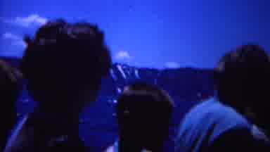 Yellowstone Wyoming (1967): People Outside Together With Their Hair Blowing In The