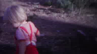 Yellowstone Wyoming (1967): Small Children Is Chasing Ants And He Does Not Seem To
