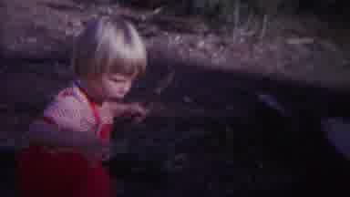 Yellowstone Wyoming (1967): Girl Finds Fun In Water Puddle Out Front Of Home