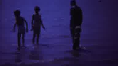 Yellowstone Wyoming (1967): One Mother And Their Three Kids Playing In Beach Side
