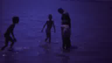 Yellowstone Wyoming (1967): The Children Play In The Ocean While Their Mother