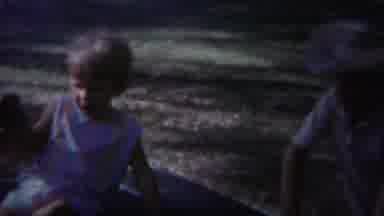 Yellowstone Wyoming (1967): Sibling Children Playing In A Grassy Yard With An Oven