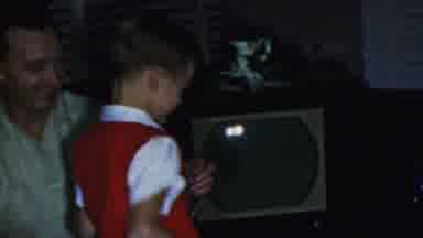 Paramus New Jersey (1959): Young Boy In Red Vest Moves From Woman Past Christmas