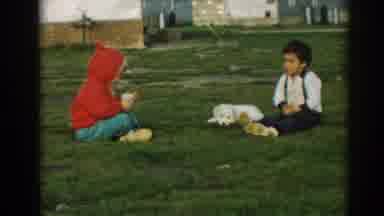 Ephesus Turkey (1962): Some Small Kids Playing Each Other Around A White Dog