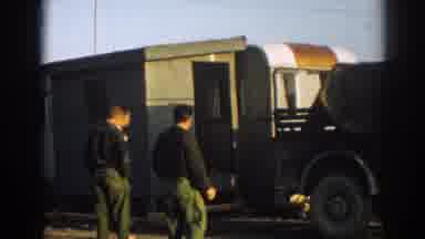 Ephesus Turkey (1962): Dark Green Trucks Tow Green Outhouse On A Sunny Day
