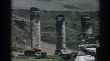 Ephesus Turkey (1962): View Of Grey Stone Objects At Base Of Mountain On A Clear