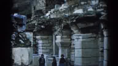 Ephesus Turkey (1962): Four People Walking Around A Temple During The Day Time
